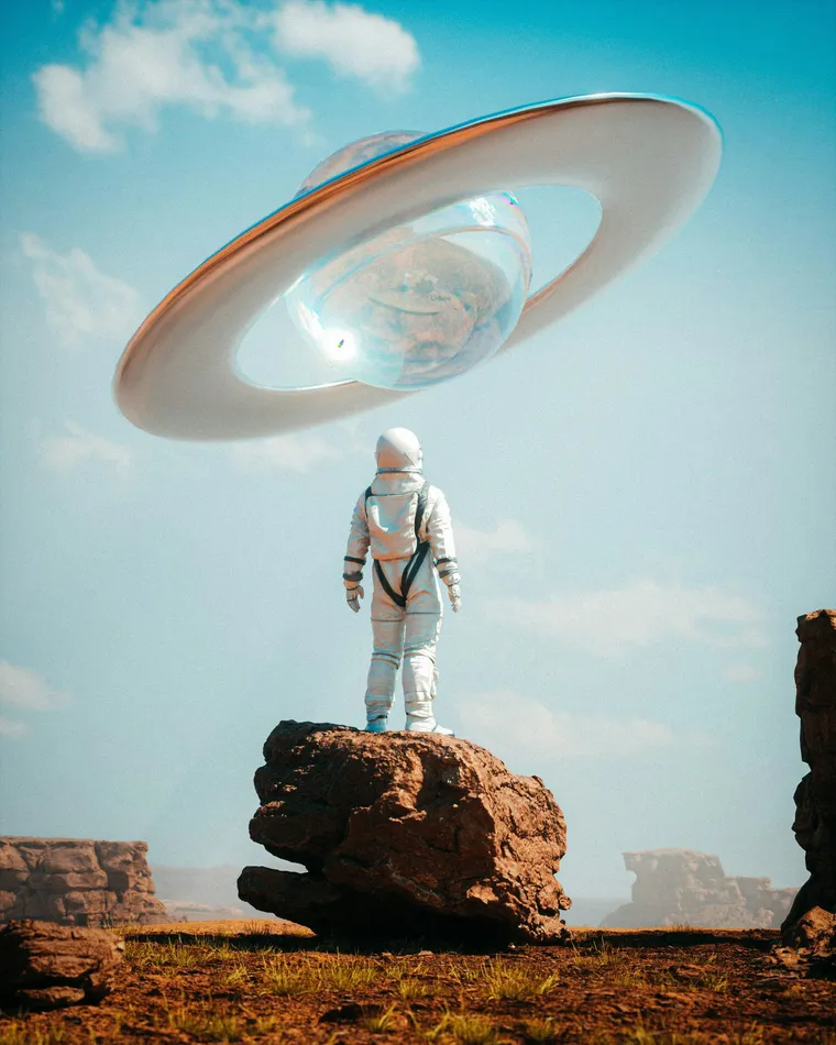 An astronaut standing on a rock beneath a ringed planet